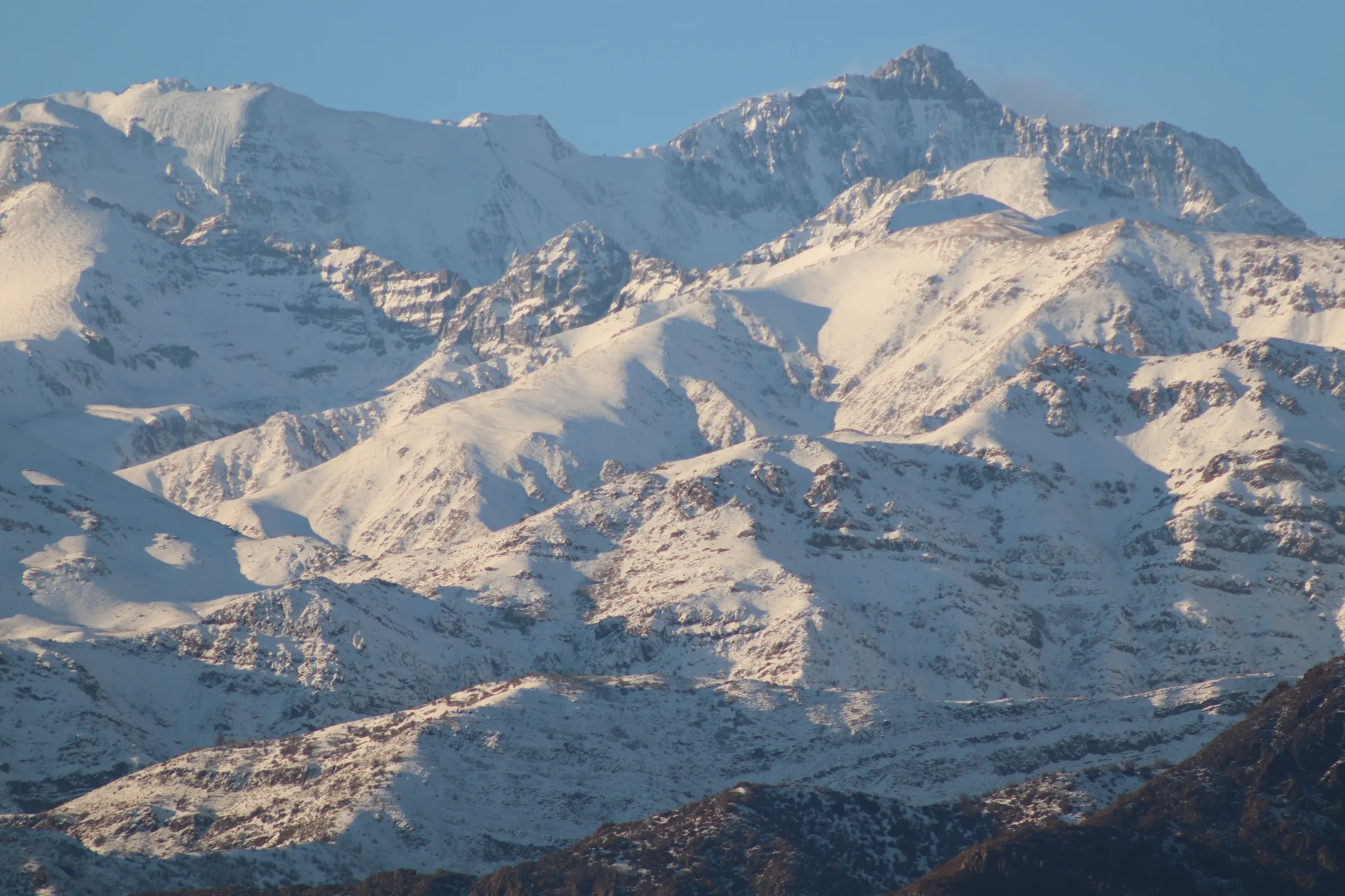 Snow-covered peaks of the Central Andes in morning light, near Santiago
